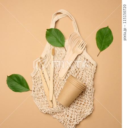 Cotton bag, wooden spoon, cups on a brown background. Waste recycling concept, Cotton bag, wooden spoon, cups on a brown background. Waste recycling concept, 115150720