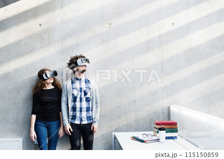 Young university students with VR headset. Virutal reality in academic settings. Young university students with VR headset. Virutal reality in academic settings. 115150859