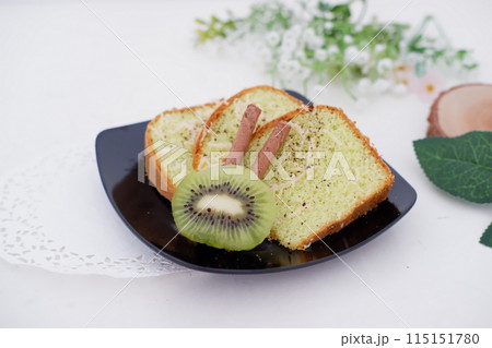 sliced cake with kiwi fruit as a background sliced cake with kiwi fruit as a background 115151780