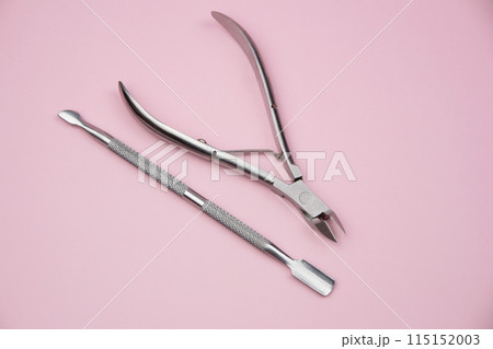 Manicure kit, professional grooming set, nail scissors with cuticle pusher, professional stainless steel pedicure manicure tools for fingernails and toenails on a dark background Manicure kit, professional grooming set, nail scissors with cuticle pusher, professional stainless steel pedicure manicure tools for fingernails and toenails on a dark background 115152003