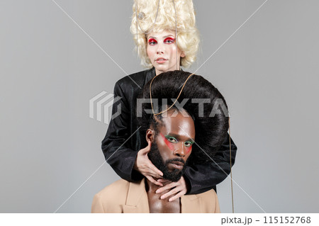 Gay man and woman in makeup and wigs posing 115152768