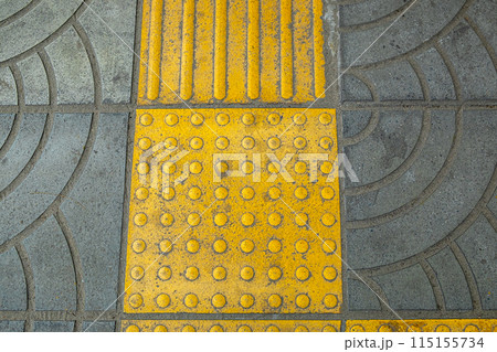 Yellow Braille Blocks on the Sidewalk, Providing a Pathway for Visually Impaired Individuals Yellow Braille Blocks on the Sidewalk, Providing a Pathway for Visually Impaired Individuals 115155734