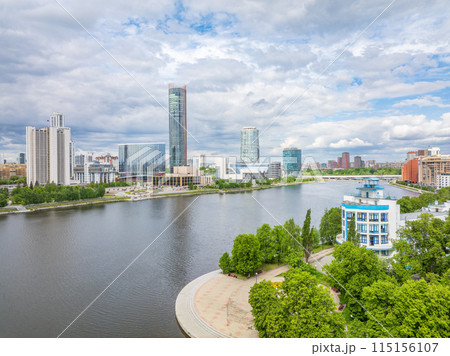 Yekaterinburg city with Buildings of Regional Government and Parliament, Dramatic Theatre, Iset Tower, Yeltsin Center, panoramic view at summer sunset. Yekaterinburg city with Buildings of Regional Government and Parliament, Dramatic Theatre, Iset Tower, Yeltsin Center, panoramic view at summer sunset. 115156107
