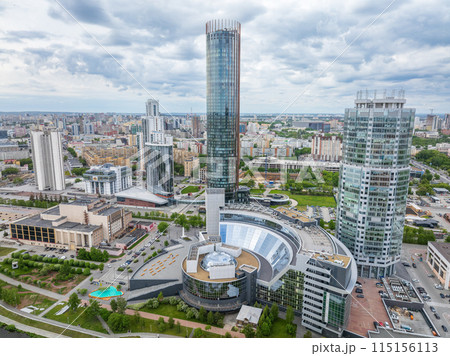 Yekaterinburg city with Buildings of Regional Government and Parliament, Dramatic Theatre, Iset Tower, Yeltsin Center, panoramic view at summer sunset. Yekaterinburg city with Buildings of Regional Government and Parliament, Dramatic Theatre, Iset Tower, Yeltsin Center, panoramic view at summer sunset. 115156113