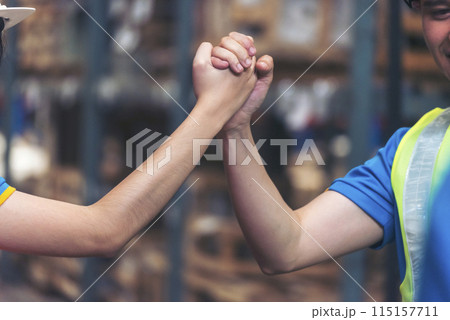 Diversity Teamwork Warehouse worker fist bump together trust partner. Engineer man, women hands partnership. Coworker colleague logistics Warehouse agreement. Multiracial Two people fist bump partner 115157711