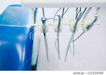 Different professional dental equipment, instruments and tools in a dentists stomatology office clinic. 115158480