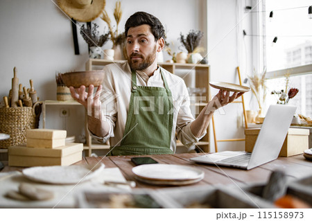 Portrait of mature man does not know which item send to buyer 115158973
