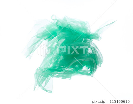 Green Organza fabric flying in curve shape, Piece of textile blue sky organza fabric throw fall in air. White background isolated motion blur Green Organza fabric flying in curve shape, Piece of textile blue sky organza fabric throw fall in air. White background isolated motion blur 115160610