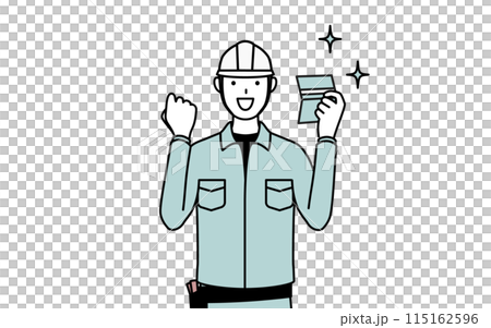A man wearing a helmet and work clothes is happy to see his bankbook 115162596
