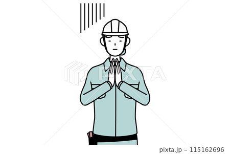 体の前で手を合わせて謝るヘルメットと作業着姿の女性技師 115162696