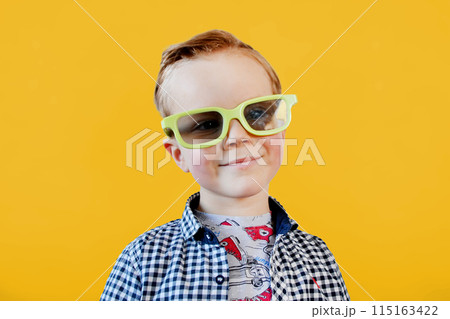 Cute fun kid baby boy 4 year old in red t-shirt holding bucket for popcorn Cute fun kid baby boy 4 year old in red t-shirt holding bucket for popcorn 115163422