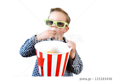 Cute fun kid baby boy 4 year old in red t-shirt holding bucket for popcorn 115163436