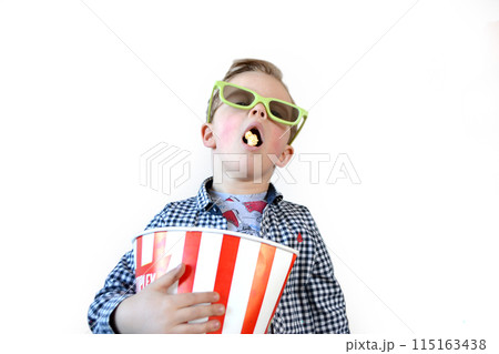 Cute fun kid baby boy 4 year old in red t-shirt holding bucket for popcorn 115163438