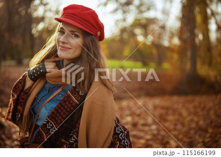 Portrait of stylish woman in red hat with scarf and gloves Portrait of stylish woman in red hat with scarf and gloves 115166199