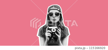 Stylish happy young woman photographer taking picture on camera blowing a kiss on pink background Stylish happy young woman photographer taking picture on camera blowing a kiss on pink background 115166920