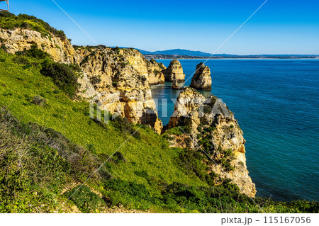 Ponta da Piedade is a unique rock formation with famous grottos in the ocean at Lagos, Algrave, Portugal Ponta da Piedade is a unique rock formation with famous grottos in the ocean at Lagos, Algrave, Portugal 115167056