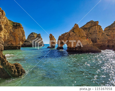 Ponta da Piedade is a unique rock formation with famous grottos in the ocean at Lagos, Algrave, Portugal Ponta da Piedade is a unique rock formation with famous grottos in the ocean at Lagos, Algrave, Portugal 115167058