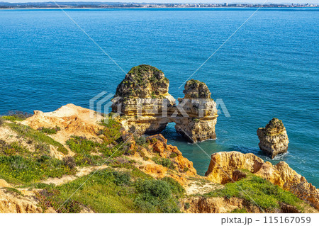 Ponta da Piedade is a unique rock formation with famous grottos in the ocean at Lagos, Algrave, Portugal Ponta da Piedade is a unique rock formation with famous grottos in the ocean at Lagos, Algrave, Portugal 115167059