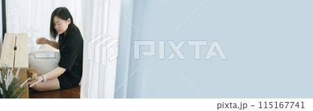 pet care concept with owner during read book and play with british cat in livingroom 115167741