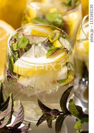 A glass of refreshing lemon water with mint 115168130
