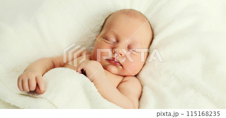 Portrait of infant sweet sleeping lying on white bed at home Portrait of infant sweet sleeping lying on white bed at home 115168235