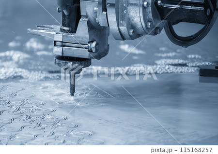 Close-up scene of multi-axis abrasive waterjet cutting machine cutting the aluminum plate. 115168257