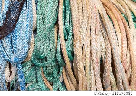 Assorted Group of recycled plastic ropes background. Full frame 115171086