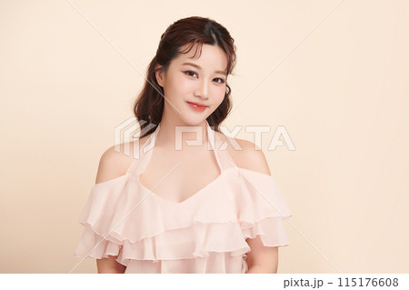 Beautiful young asian woman with clean fresh skin on beige background, Face care, Facial treatment, Cosmetology, beauty and spa, Asian women portrait. 115176608