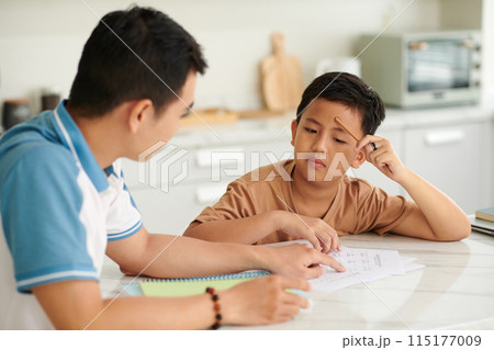 Boy Listening to Father Explaining Topic Boy Listening to Father Explaining Topic 115177009