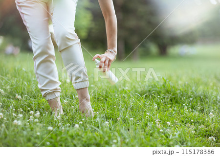 Closeup on woman with mites spray Closeup on woman with mites spray 115178386