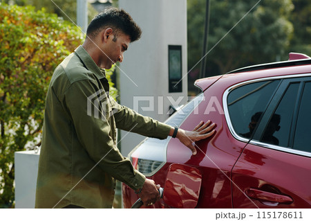 Charging Car at Public Station 115178611