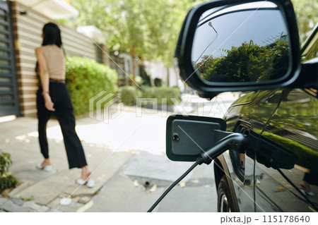 Leaving Electric Car Charging Leaving Electric Car Charging 115178640