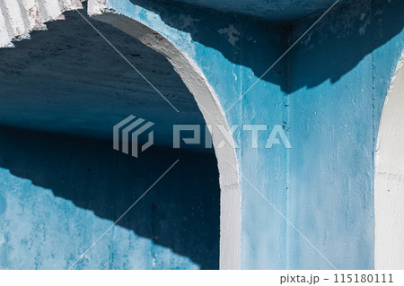 Abstract architecture photo with blue and white concrete exterior 115180111