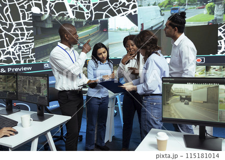Diverse group of operators discussing ways to improve express shipping and delivery, tracking orders via gps coordinates and pin on satellite map. Gather insight on cargo logistics. Diverse group of operators discussing ways to improve express shipping and delivery, tracking orders via gps coordinates and pin on satellite map. Gather insight on cargo logistics. 115181014