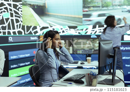 Indian call center operator gives updates on order tracking activity, handling delay complains from clients. Woman monitoring delivery trucks routes through traffic, gps satellite radar. Indian call center operator gives updates on order tracking activity, handling delay complains from clients. Woman monitoring delivery trucks routes through traffic, gps satellite radar. 115181023