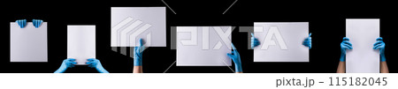Doctor's hand in sterile medical gloves holding banner isolated on black 115182045