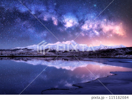 Milky Way over snowy mountains and sea coast at winter night 115182084