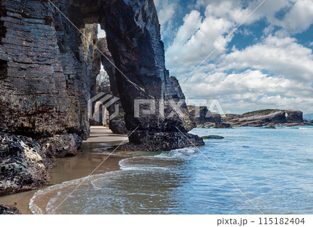 Natural arches on beach. 115182404