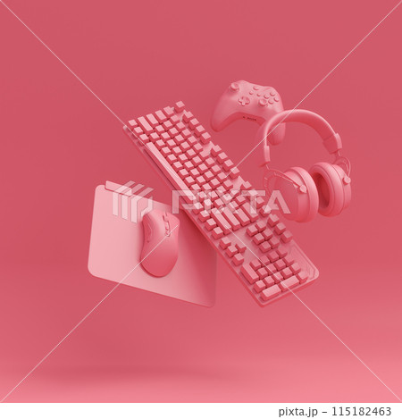 Modern home office setup featuring keyboard, gaming controllers and headphones 115182463