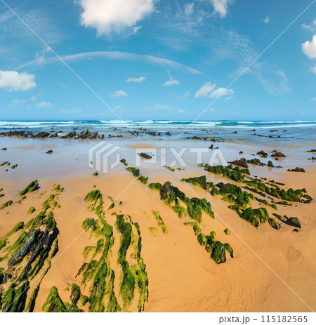 Rock formations on sandy beach (Portugal). Rock formations on sandy beach (Portugal). 115182565