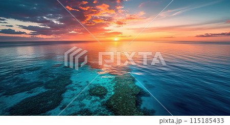 Great Barrier Reef on the coast of Queensland, Australia seascape. Coral sea marine ecosystem wallpaper background at sunset, with an orange purple sky in the evening golden hour 115185433
