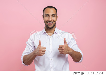 Satisfied man in white shirt showing like sign with both hands 115187381