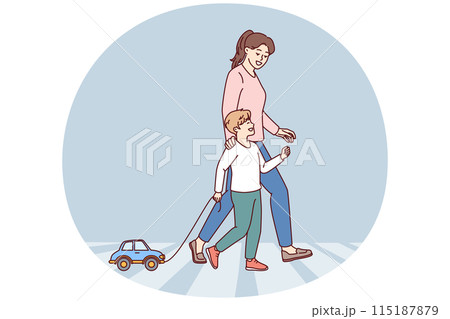 Happy mom and child going along pedestrian crossing across road walking through summer city 115187879
