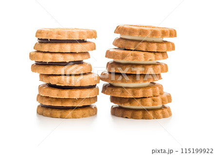 Sandwich Cookies with a cream filling isolated on white background. Sandwich Cookies with a cream filling isolated on white background. 115199922