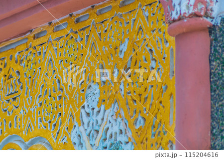 Elements of designer decoration of exterior parts of houses on streets of the city of Tangier in the Kingdom of Morocco. folk arts in the elements of decoration of facades of buildings, houses 115204616