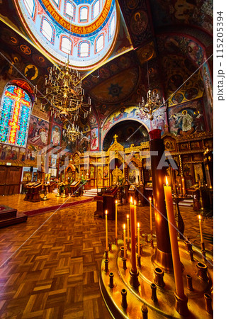 Candle prayer altar with view of interior to Holy Virgin Cathedral 115205394