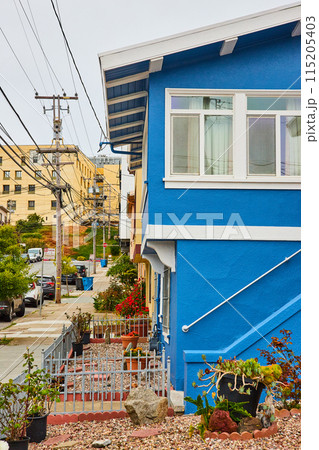Blue and white San Francisco,USA home with view down street full of houses 115205403
