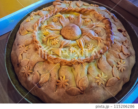 Festive cake prepared for vacation with whole family on occasion of birthday of beloved grandmother according to her recipe, that was carefully saved. Sign of home comfort, happiness near relatives Festive cake prepared for vacation with whole family on occasion of birthday of beloved grandmother according to her recipe, that was carefully saved. Sign of home comfort, happiness near relatives 115206286