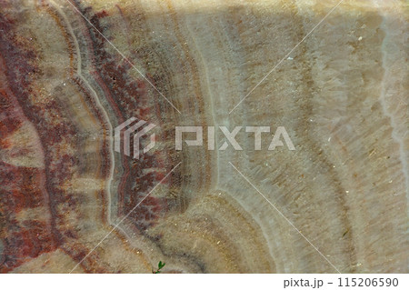 Surprisingly colorful layers in the structure of a piece of ancient marble, a variety of patterns, growths that have formed over a long time. Screensaver background, wallpaper 115206590