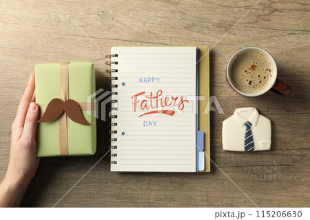 Happy father's day inscription, inscription in notebook, with gifts. Happy father's day inscription, inscription in notebook, with gifts. 115206630